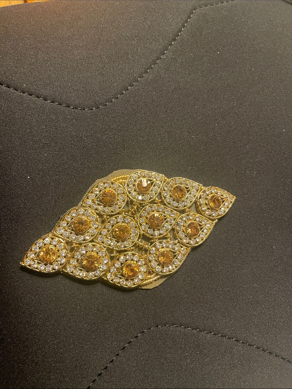 Gold-Tone Crystal Goldtone metal appliqué with Amber Crystal Accents